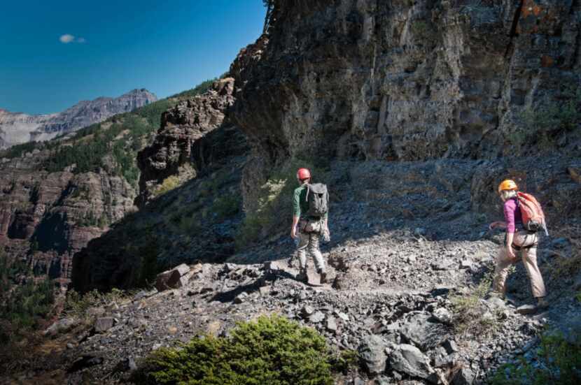 Climber Dianne Leeth follows guide Joe Eppler on the easy start of the Telluride Via...