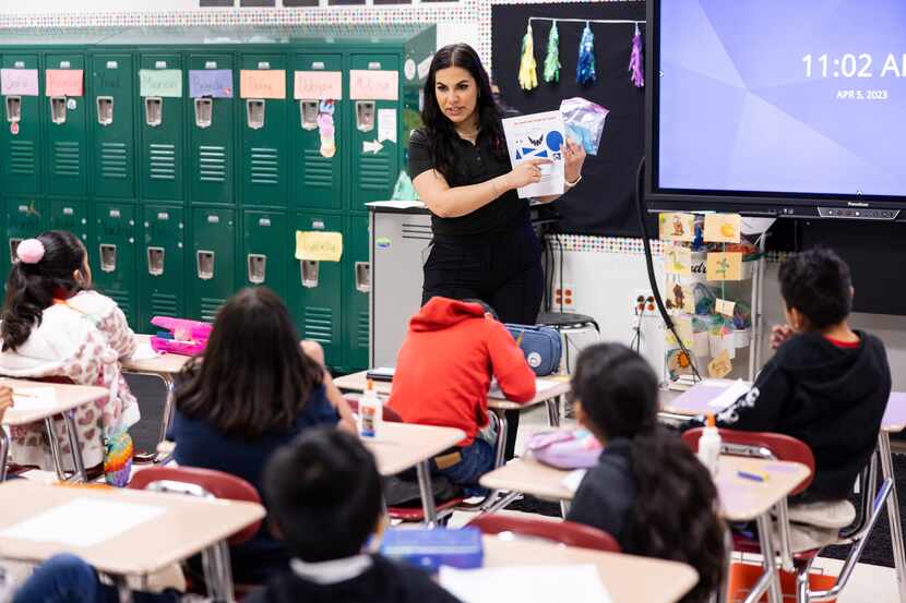 Ana Alvarez Rodriguez of Toyota talks through a literature activity in a Lancaster ISD...