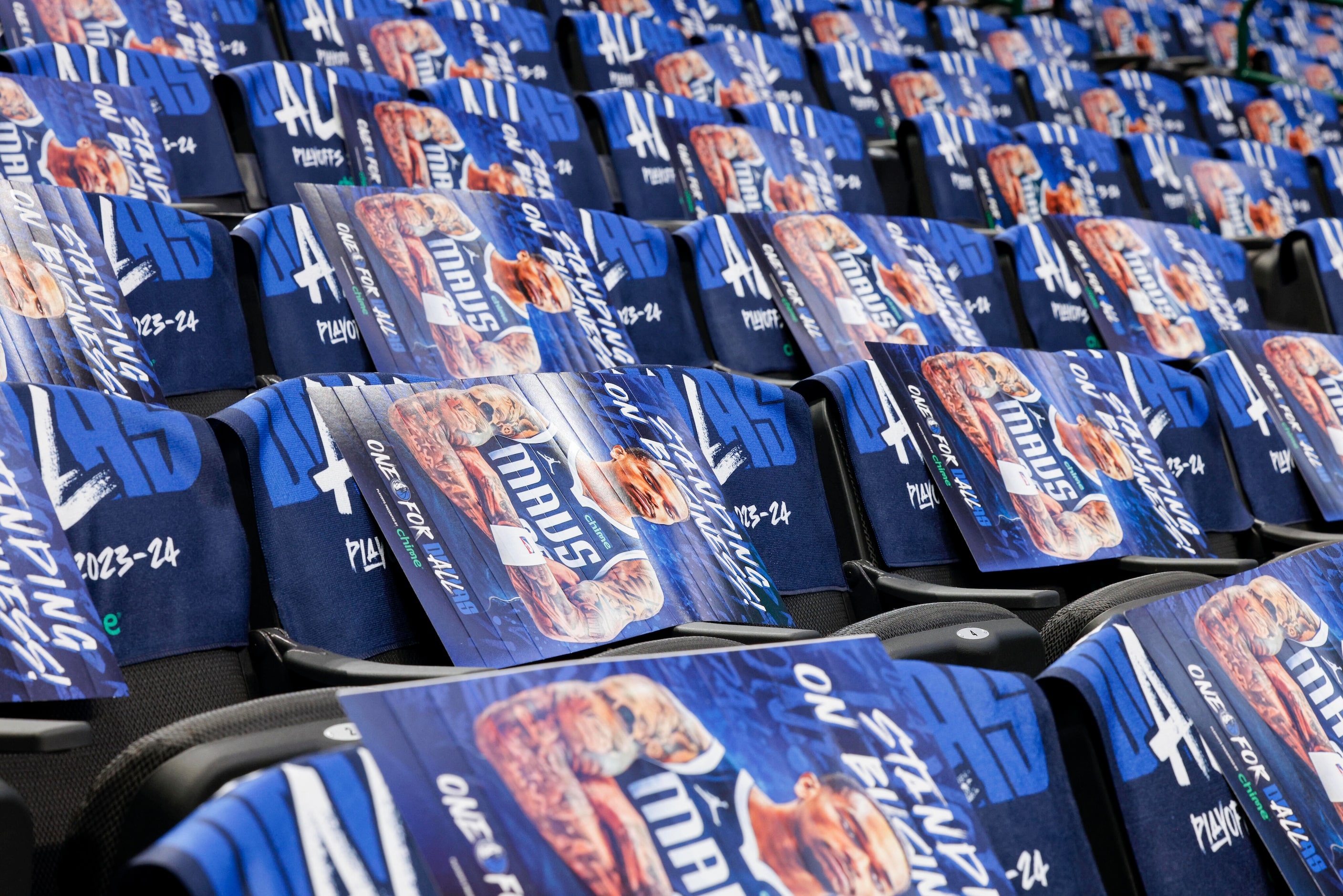 Posters of Dallas Mavericks forward P.J. Washington’s viral pose fill the seats before Game...