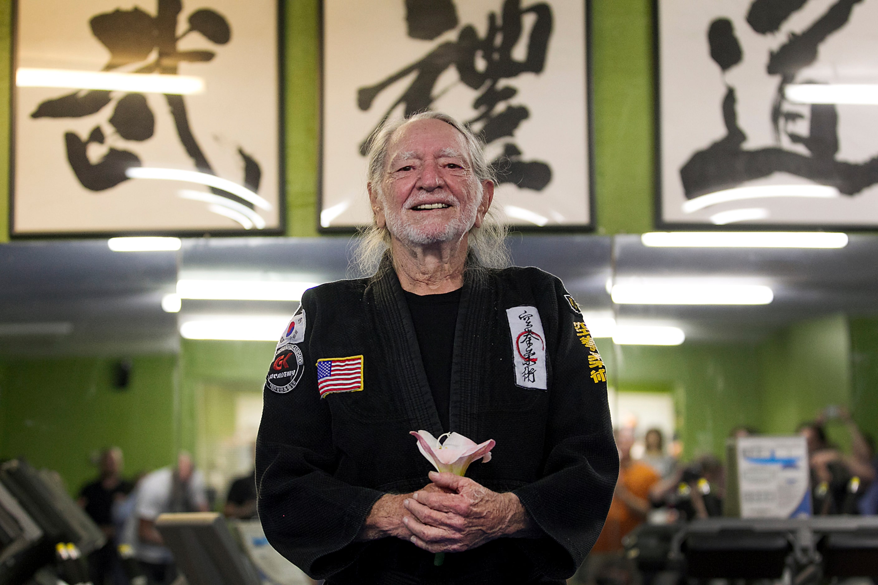 2015 - Willie Nelson smiles as he receives his fifth-degree black belt in the martial art of...