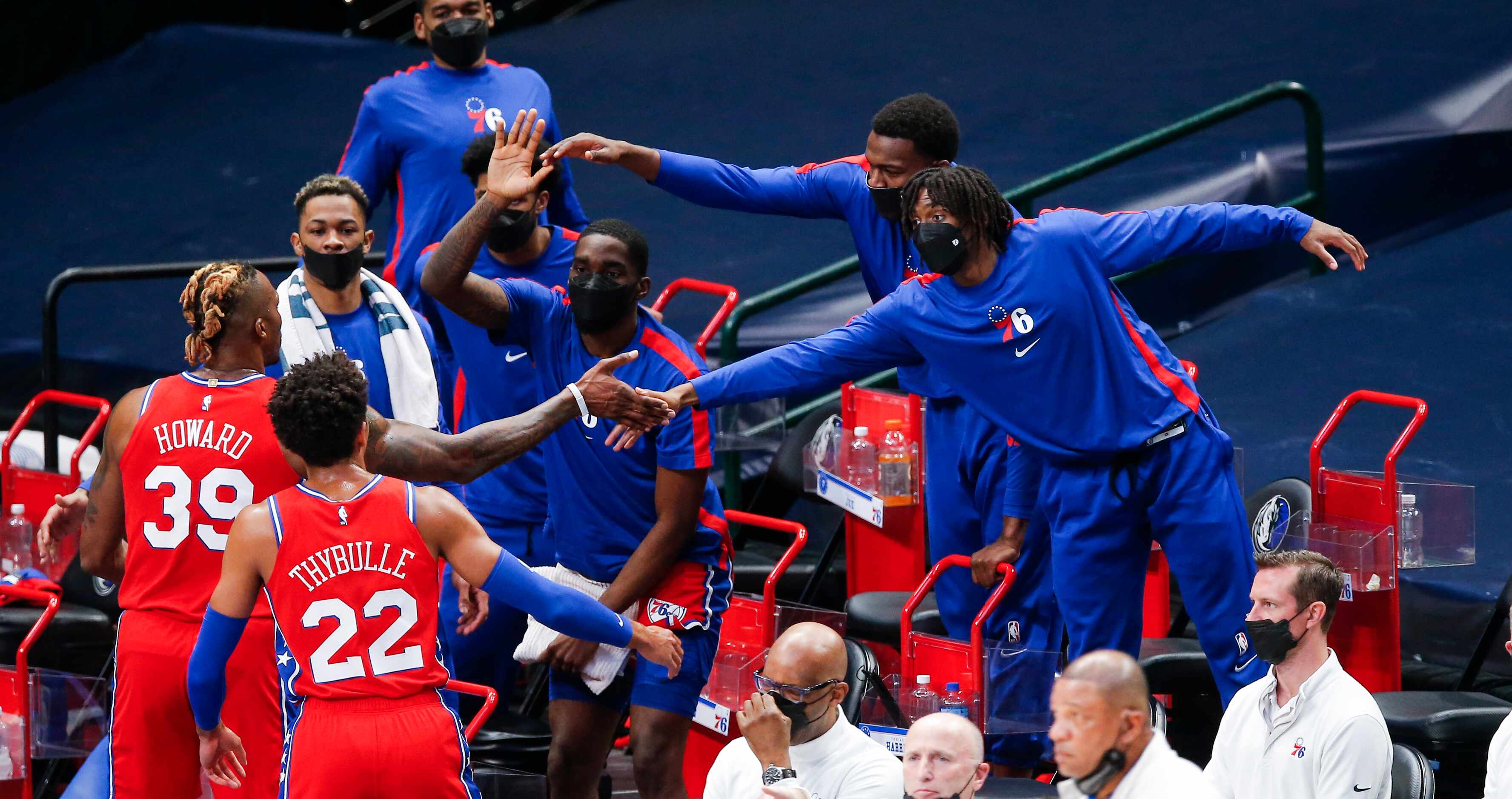 Philadelphia 76ers guard Tyrese Maxey, far right, congratulates his teammates during a...