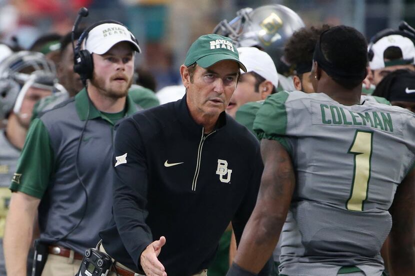 Baylor Bears head coach Art Briles congratulates wide receiver Corey Colemn in the first...