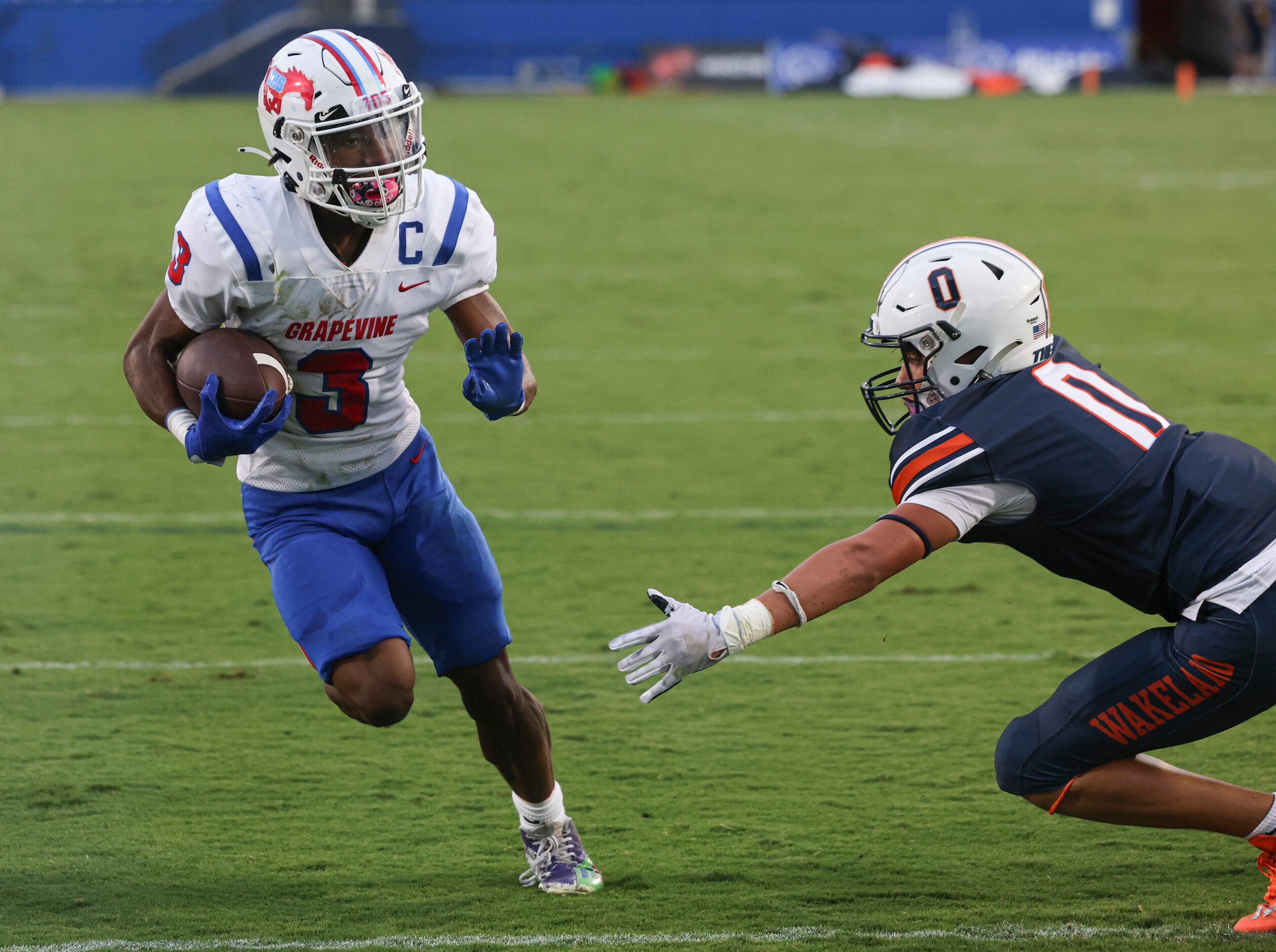 Grapevine High School’s CJ Holmes (3) runs the ball into the end zone to score a touchdown...