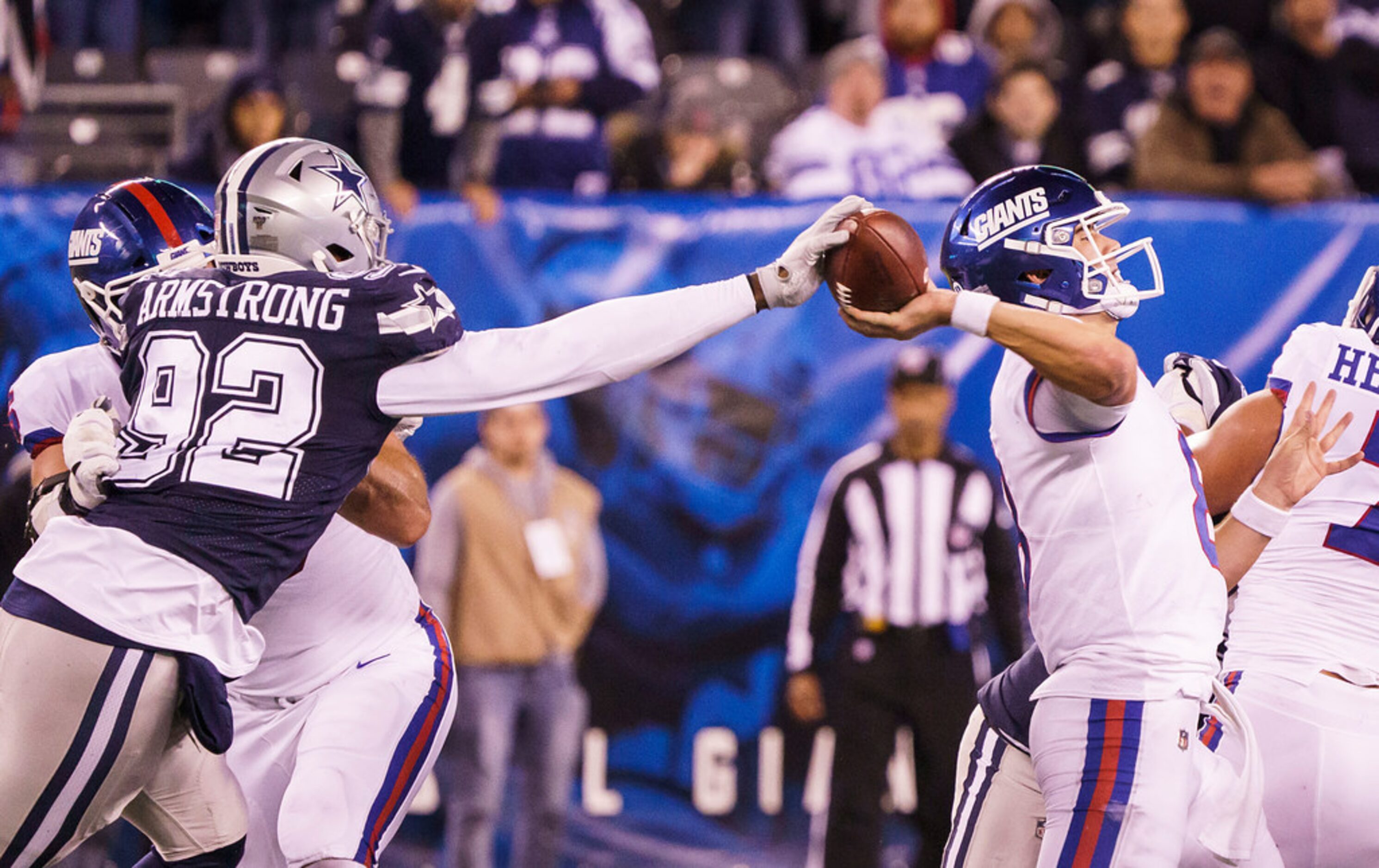 Dallas Cowboys defensive end Dorance Armstrong (92) strips the ball from New York Giants...