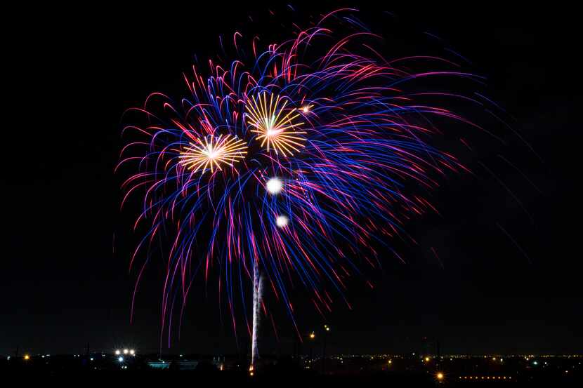 Fireworks burst during Kaboom Town festivities in Addison, Texas on Tuesday, July 3, 2018....