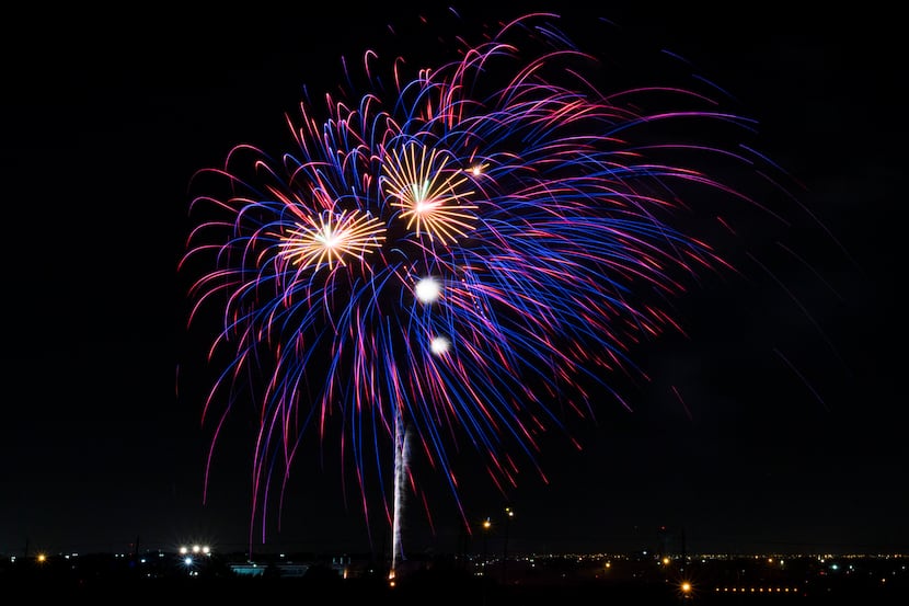 Fireworks burst during Kaboom Town festivities in Addison, Texas on Tuesday, July 3, 2018....
