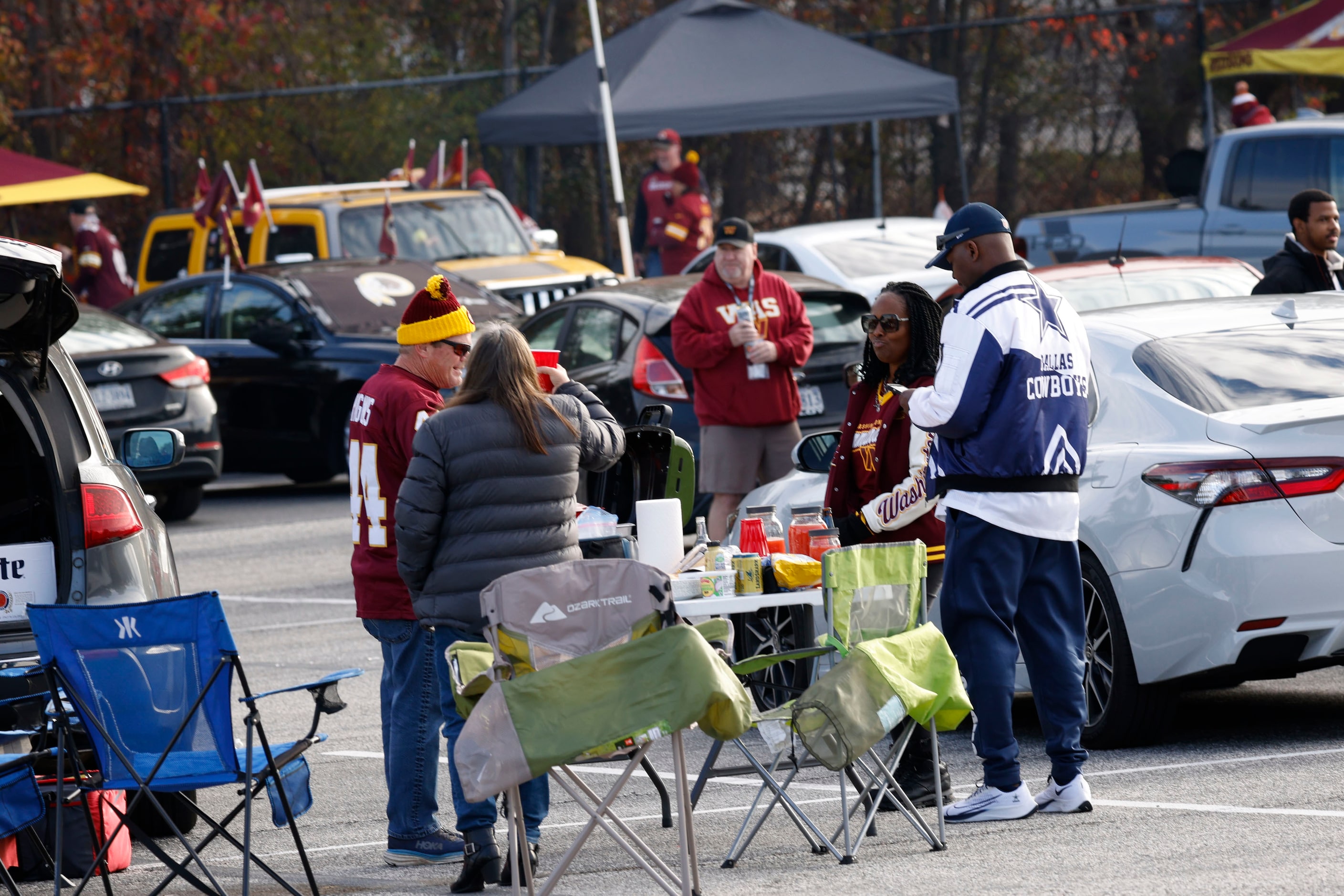 Fans spend time tailgating before an NFL football game between the Dallas Cowboys and the...