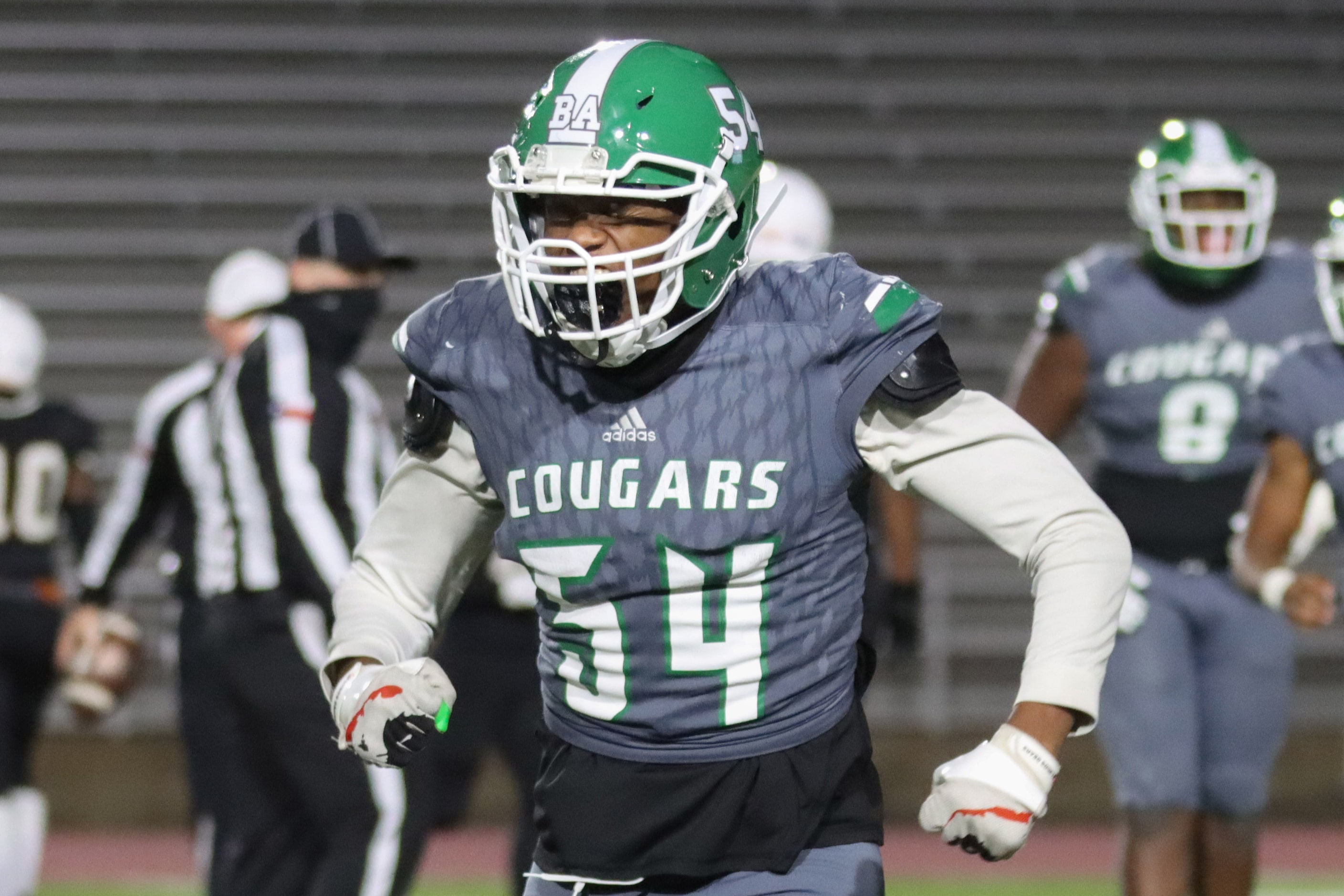 Bryan Adams offensive lineman Laymen Proctor (54) flexes after a forced fumble during the...