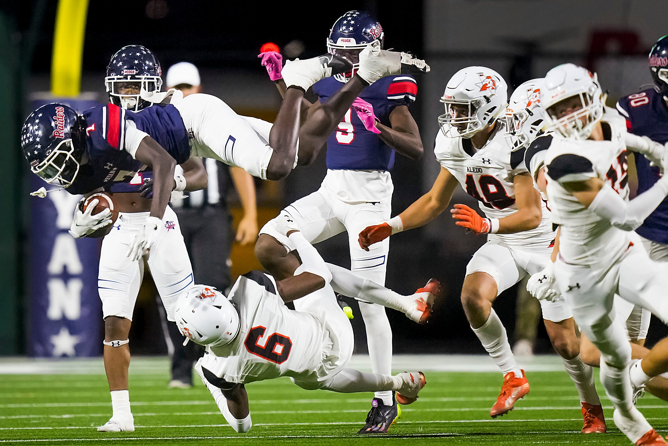 Denton Ryan’s Chance Rucker (7) is upended by Aledo defensive back Chris Johnson (6) on  a...