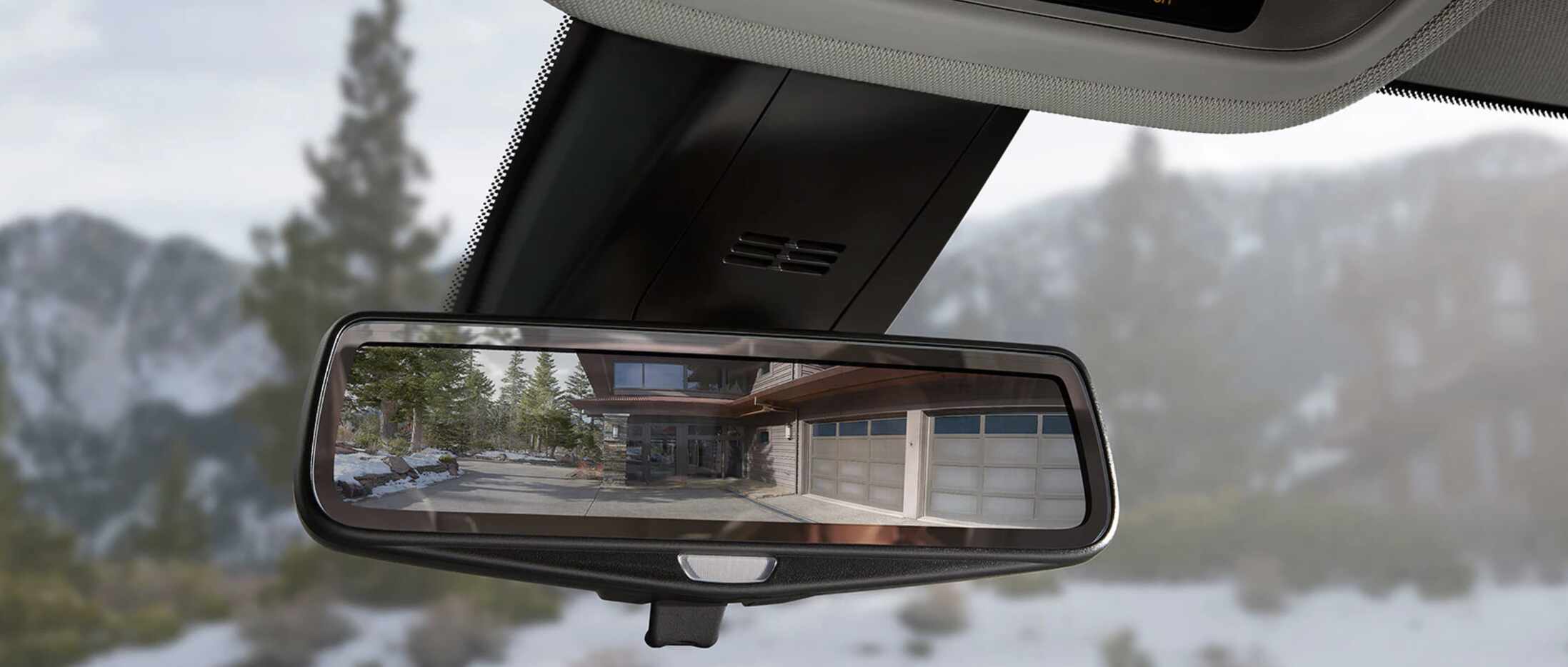 The Traverse's rearview mirror has its own screen to show the rearview camera.
