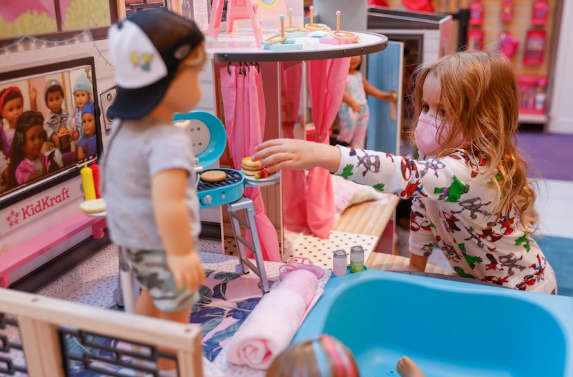 Jori Smith, 4, who was visiting from Austin, explores the first official American Girl...