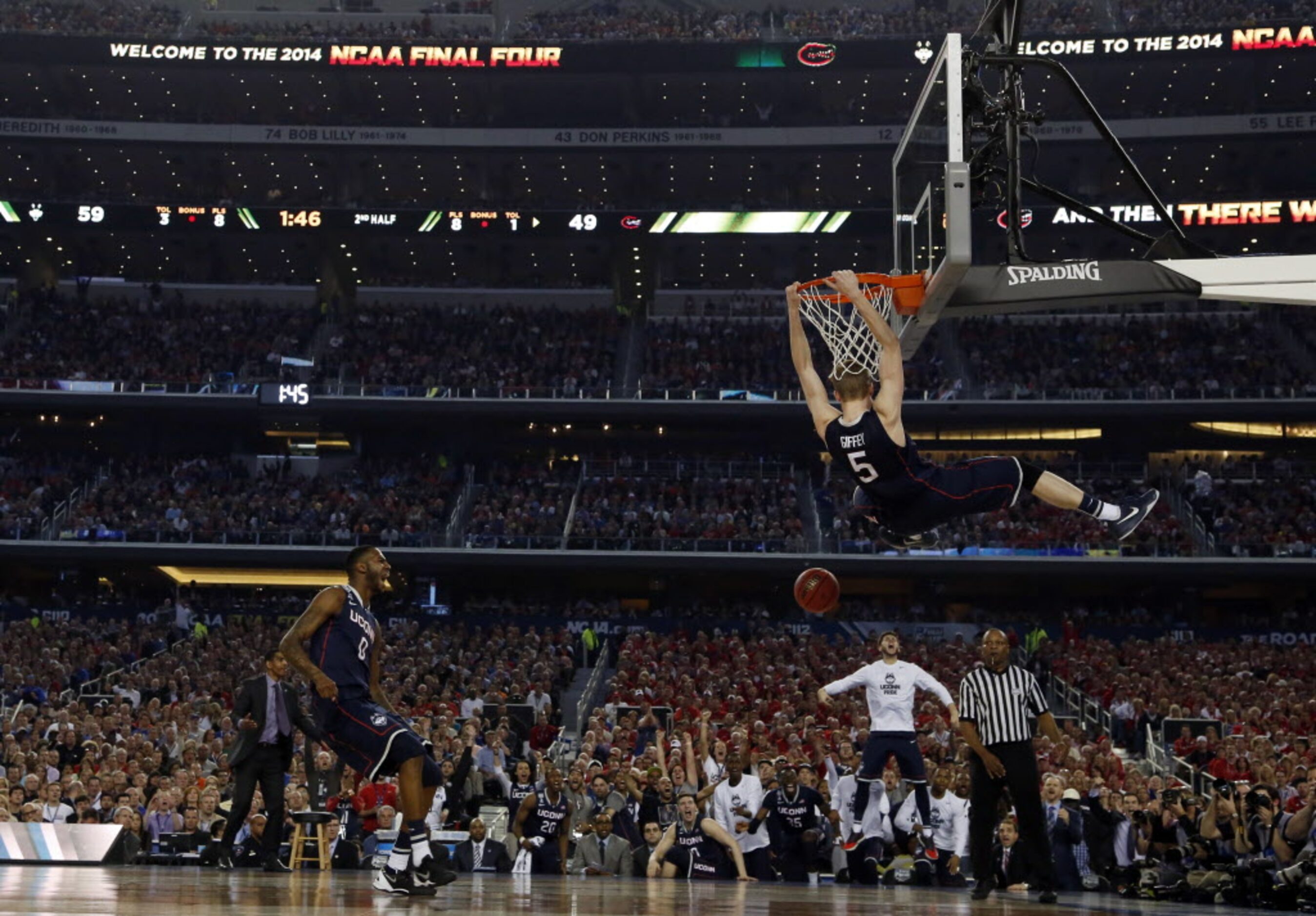 Connecticut Huskies guard/forward Niels Giffey (5) dunks the ball as Connecticut Huskies...