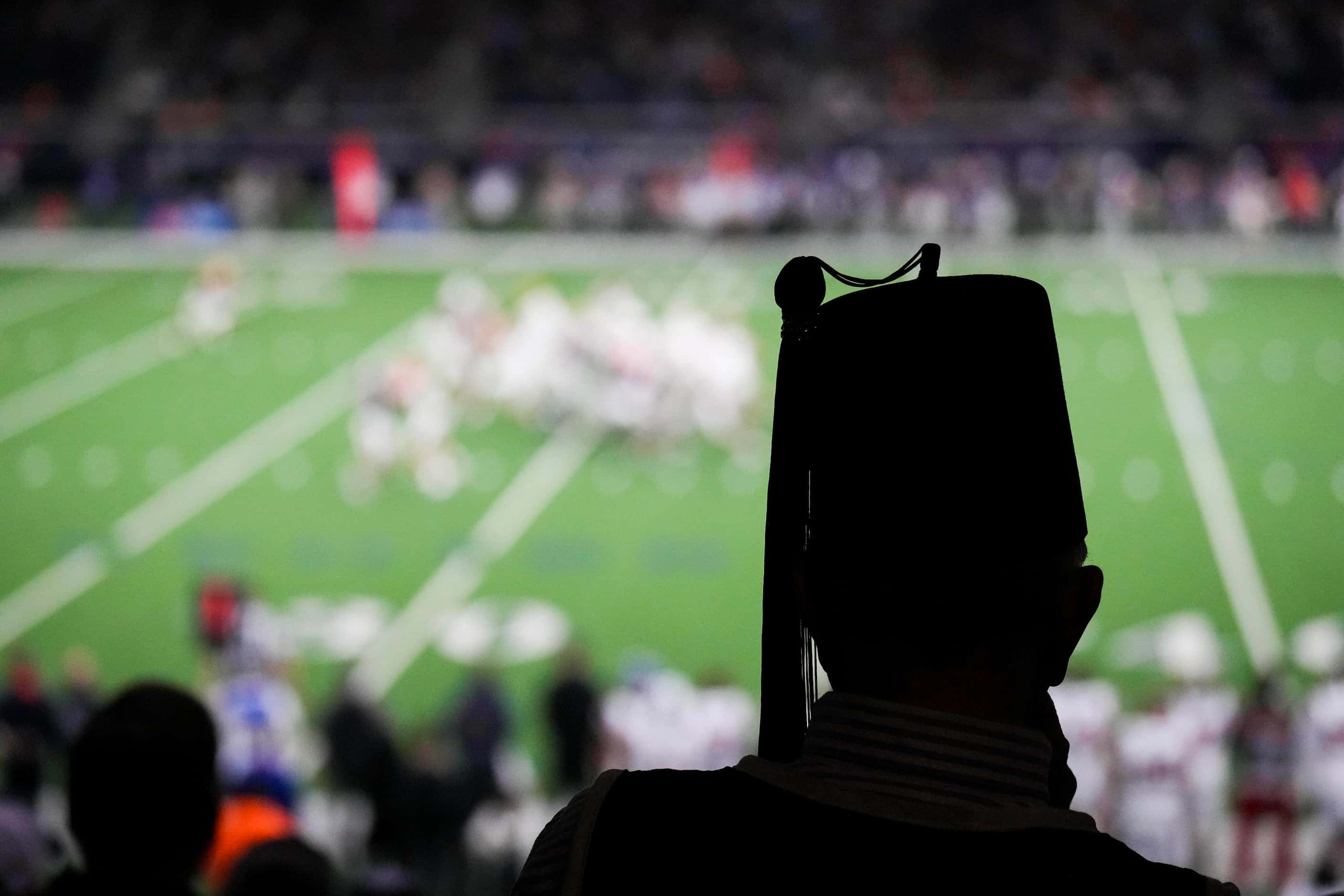 A Shriner watches from the stands during the first half of the East-West Shrine Bowl...