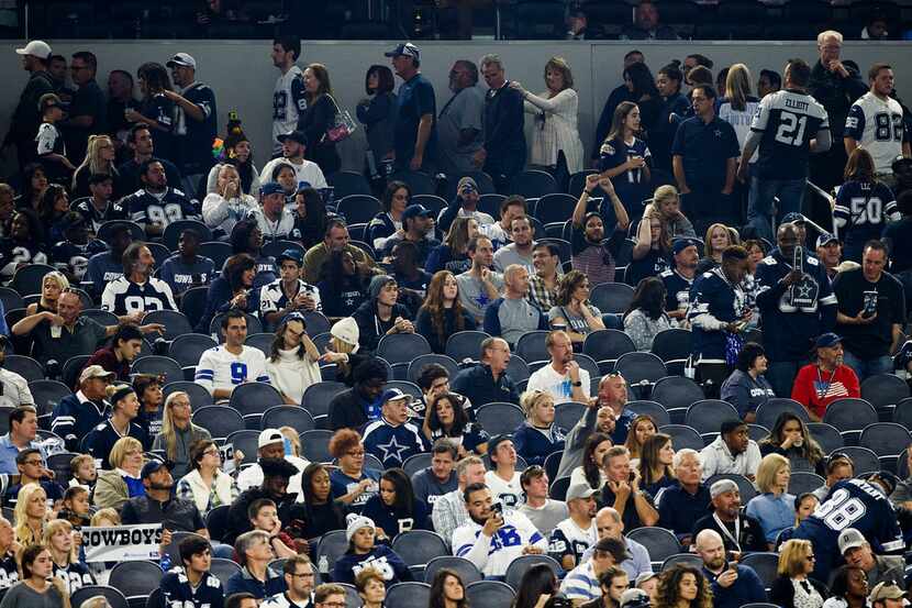 Fan head to the exits with just over seven minutes left to play after Los Angeles Chargers...