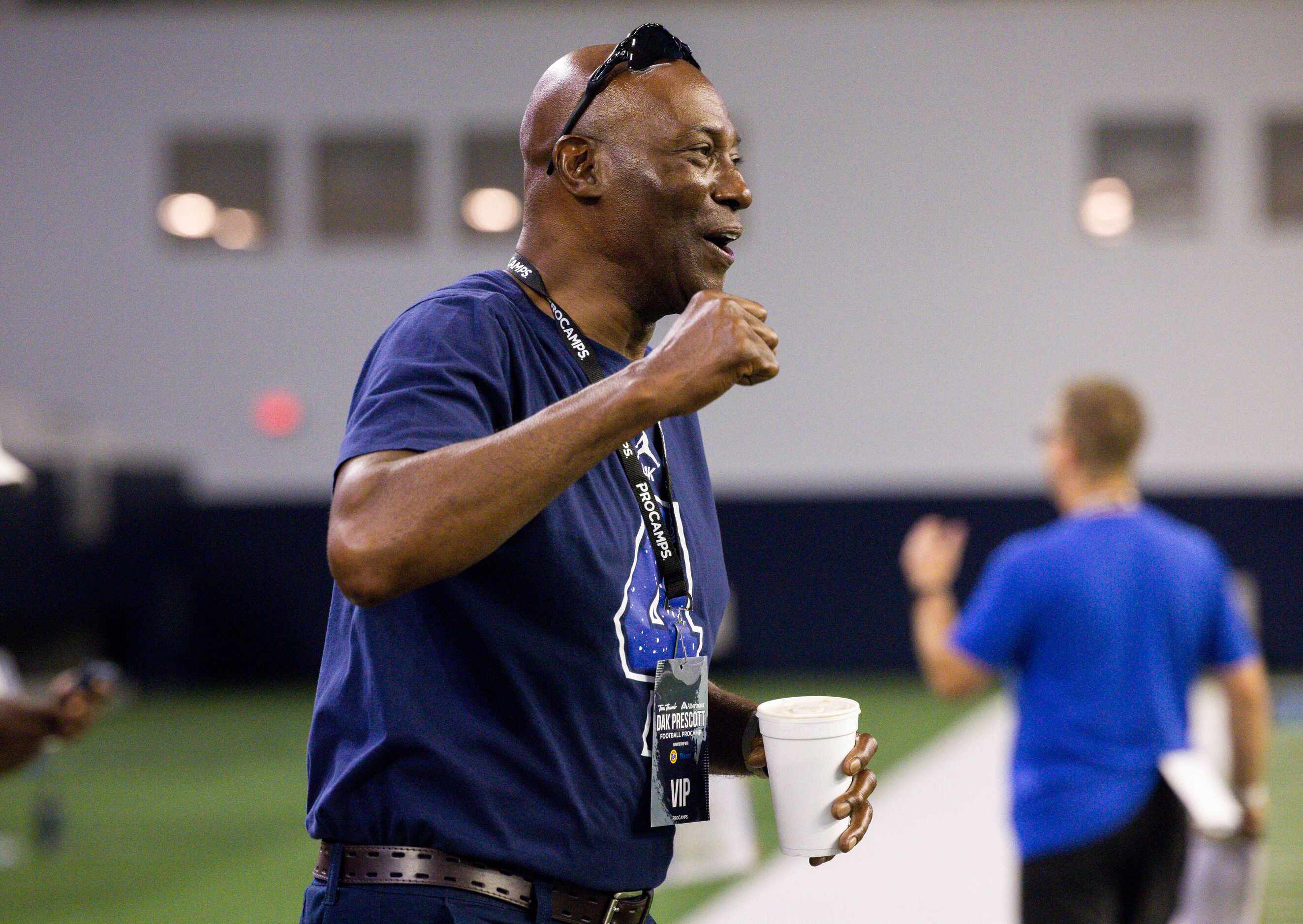 Nathaniel Prescott, father of Cowboys quarterback Dak Prescott, cheers from the sideline...