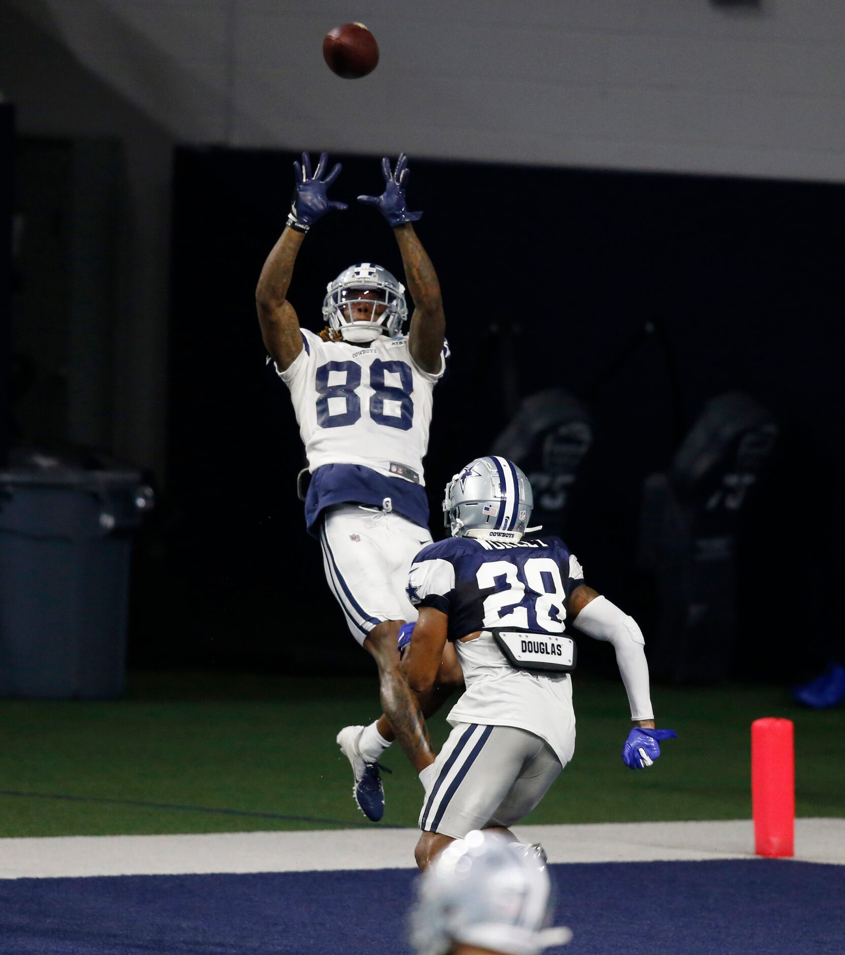 Dallas Cowboys wide receiver CeeDee Lamb (88) leaps for the ball in the end zone in front of...