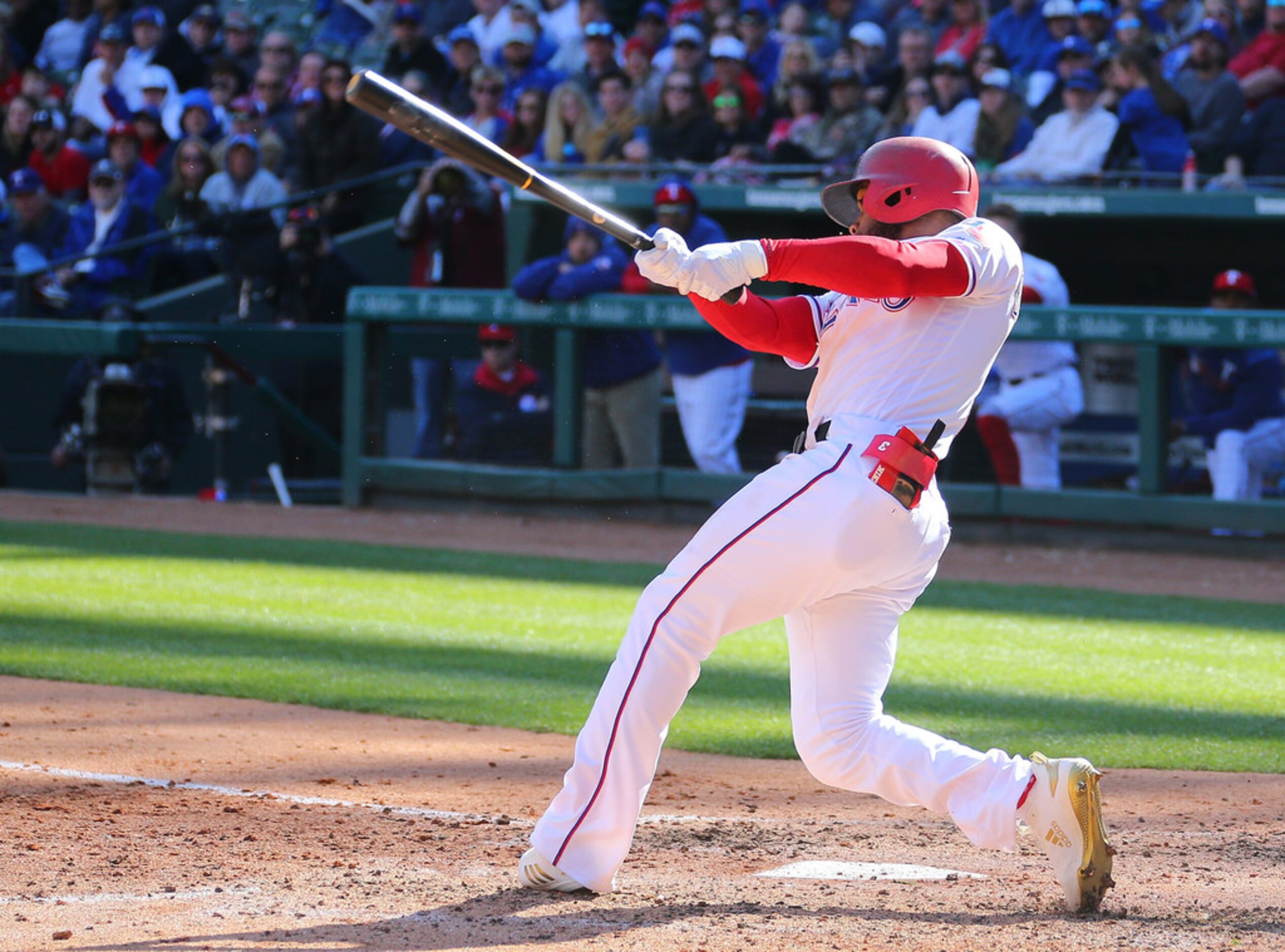 ARLINGTON, TX - MARCH 31: Delino DeShields #3 of the Texas Rangers hits a grand slam in the...