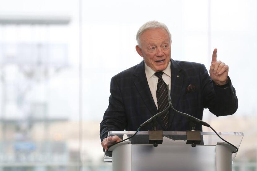 Dallas Cowboys owner Jerry Jones talks with the crowd as he hosts a news conference and...