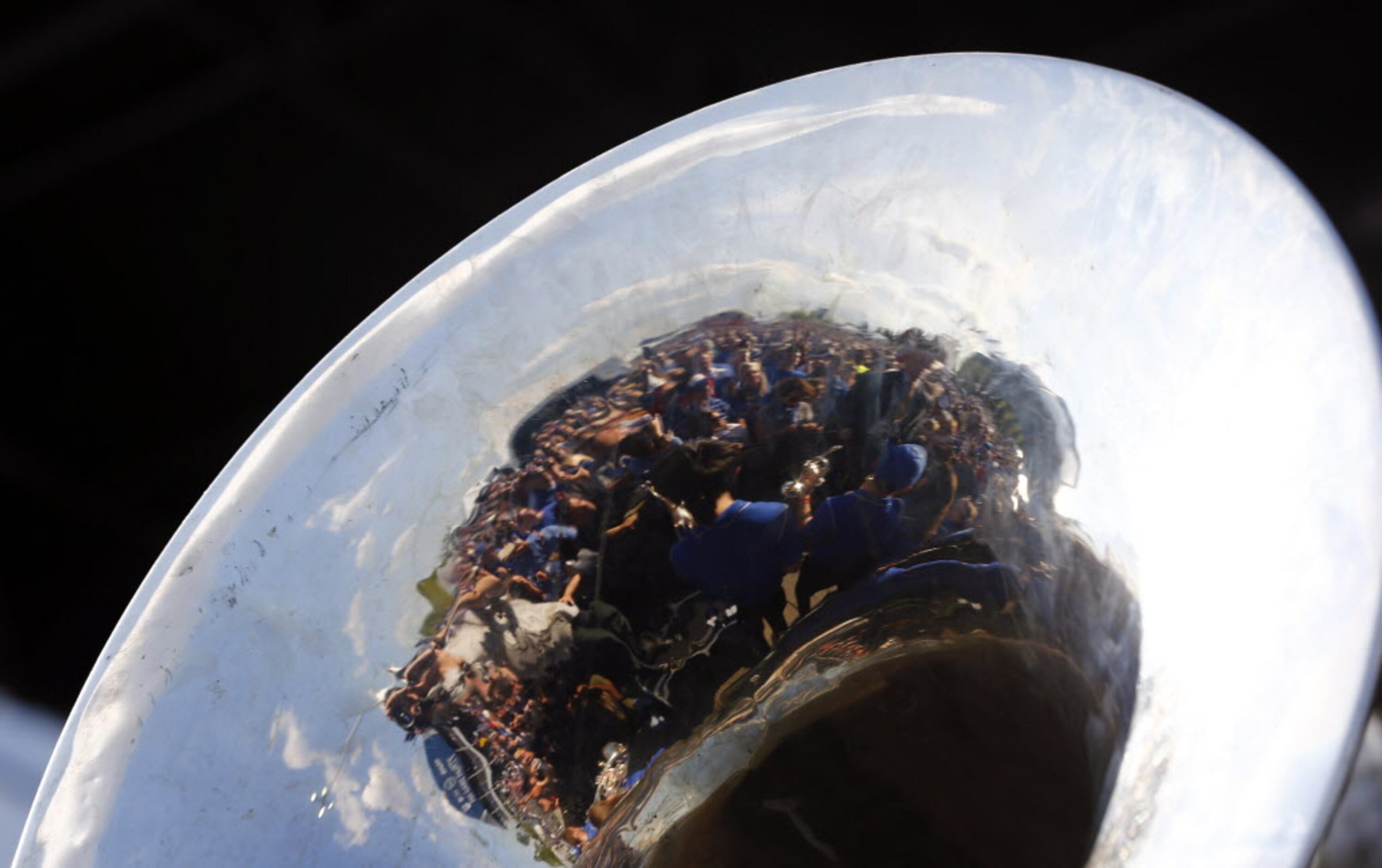 Crowd reflected in tuba at the Tip-Off Tailgate party before the game between the Kentucky...