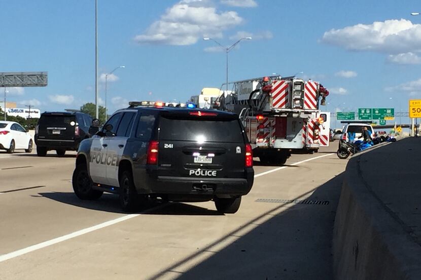 Southlake police block off traffic on State Highway 114 after about 100 motorcyclists caused...