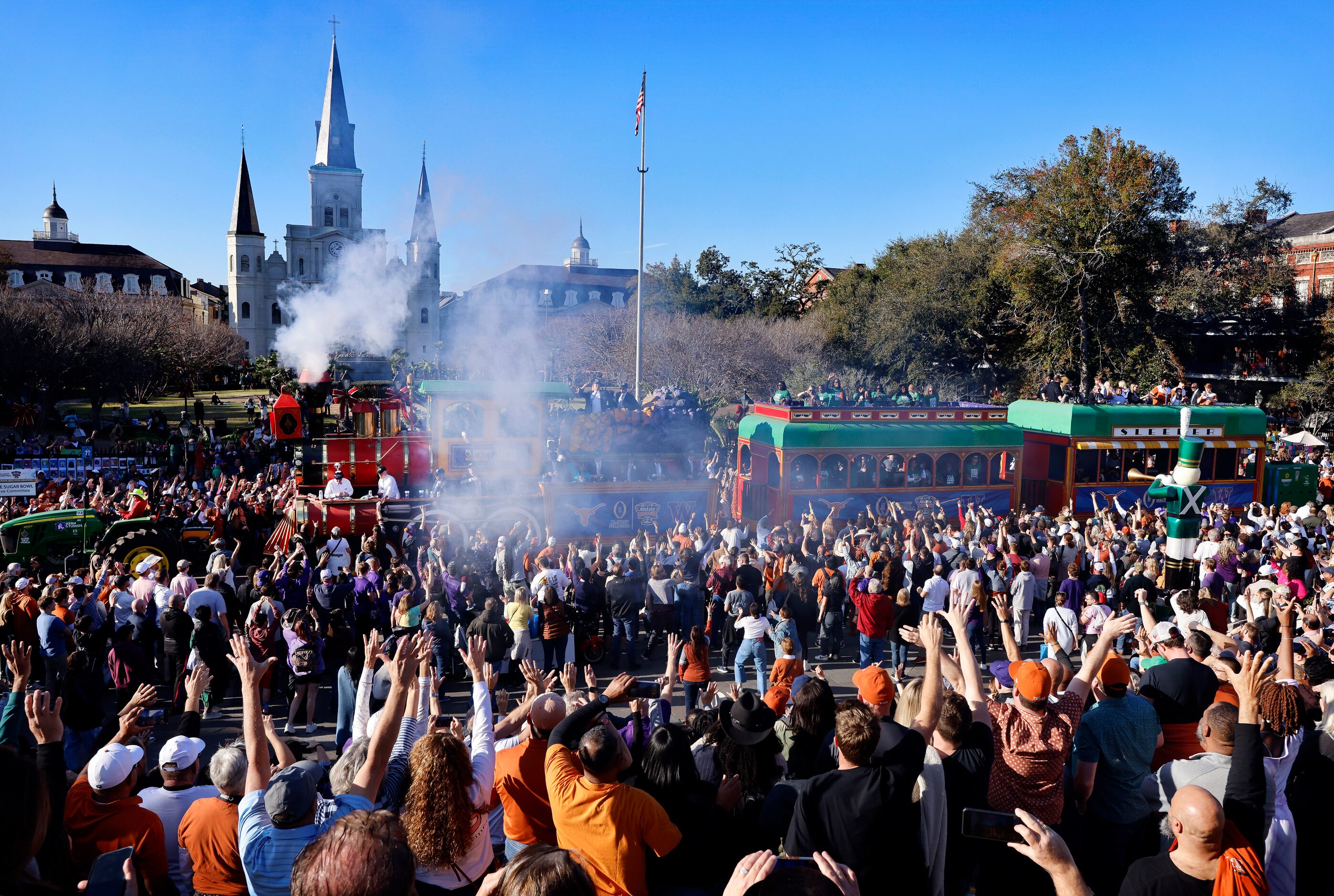 A large train carries members of the Allstate Sugar Bowl executive committee during the...