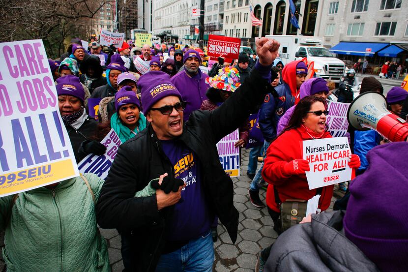 Activists protest during the "March for Health" demanding equitable and affordable access to...