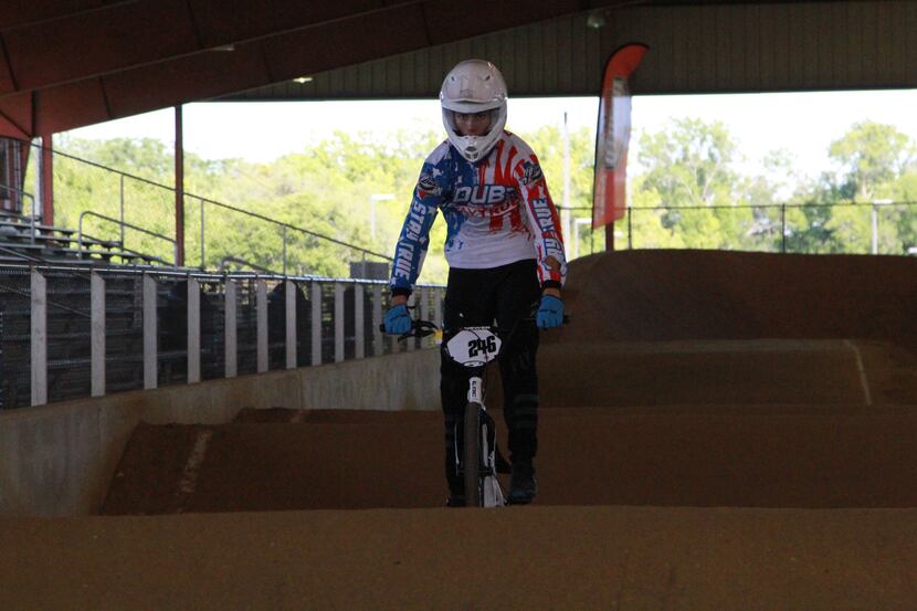 BMX rider Jacoby Irvin puts on a show during a demo at DeSoto BMX.