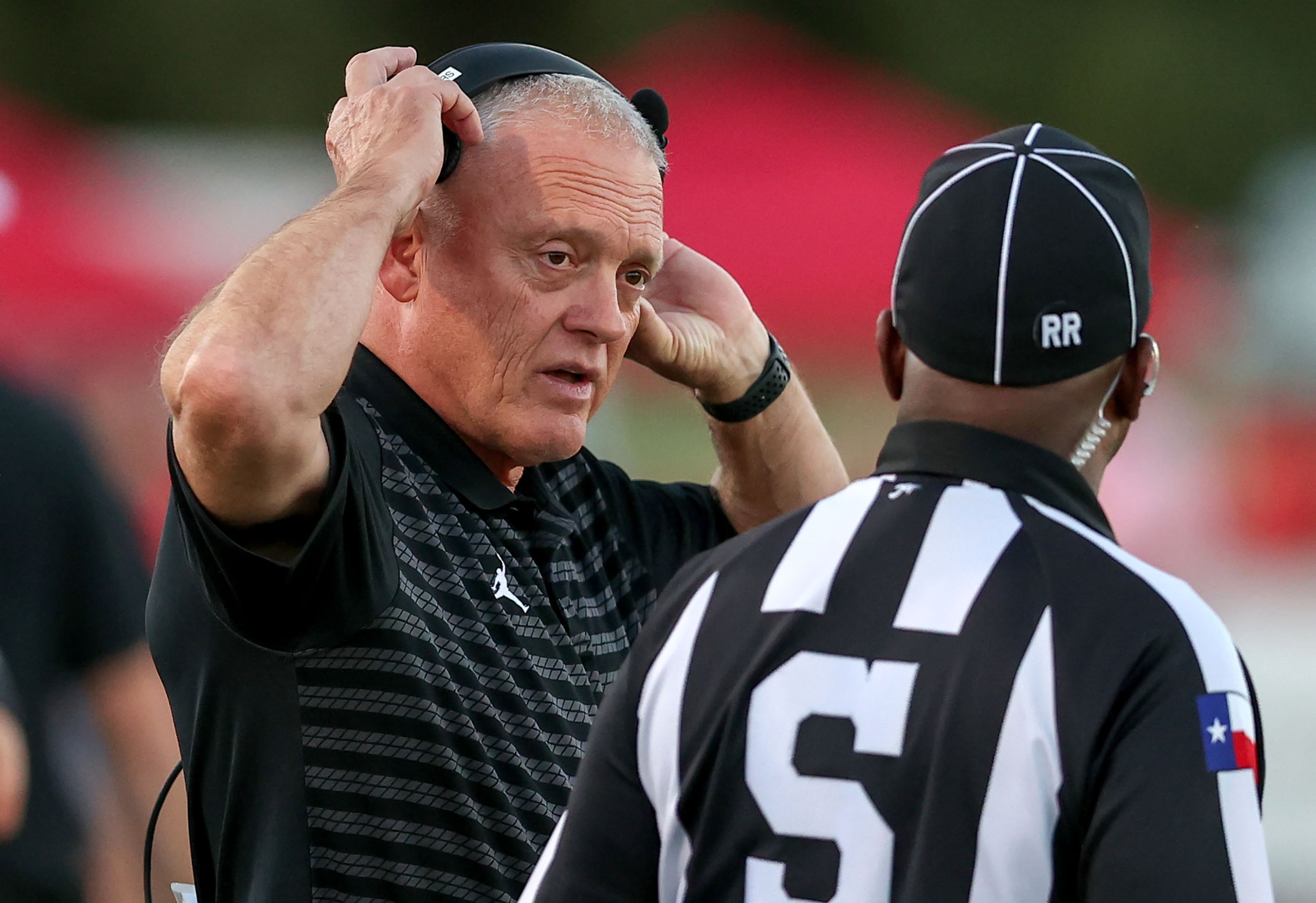 Argyle head coach Todd Rodgers has a few words to say to the official in the game against...