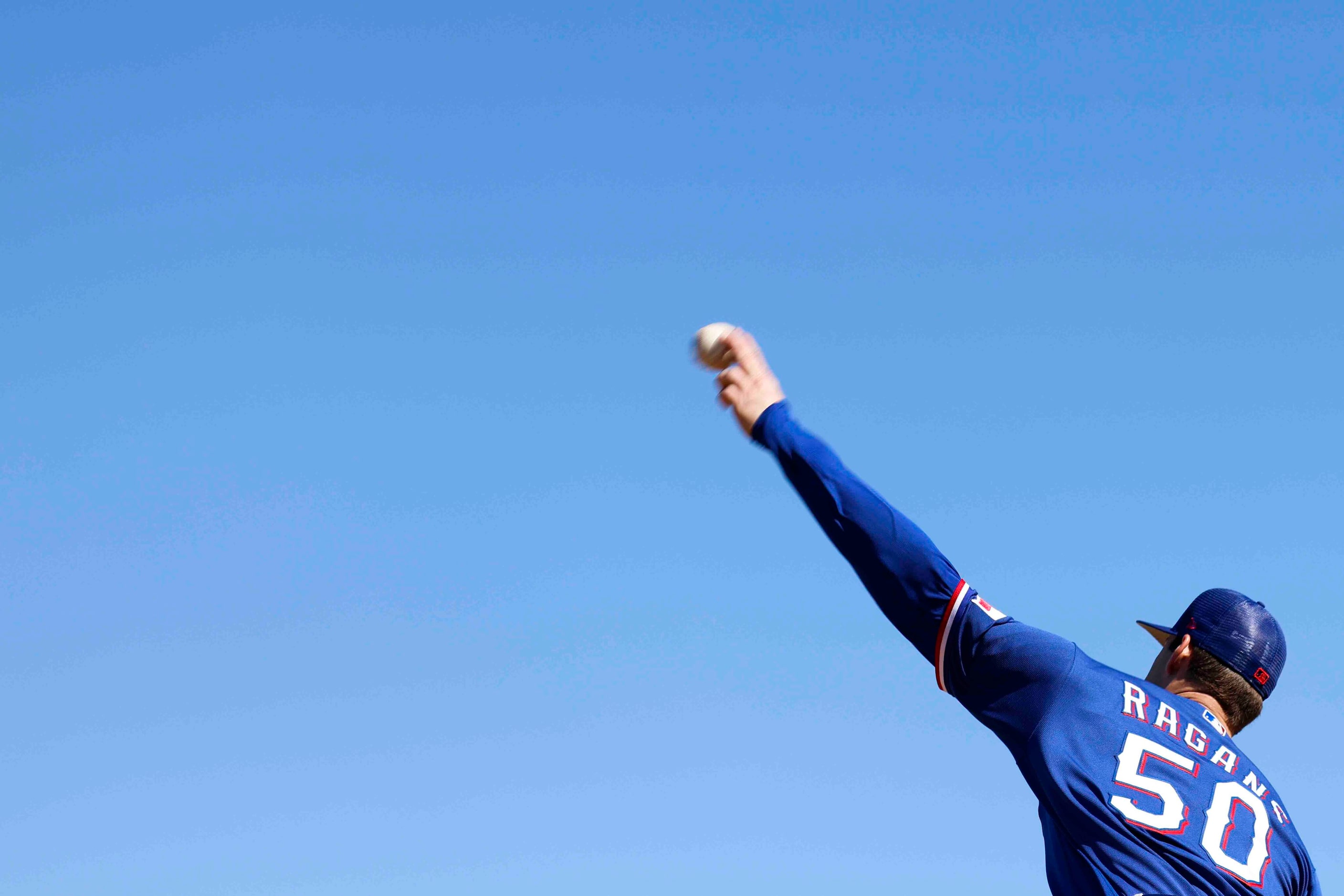 Texas Rangers left handed pitcher Cole Ragans practices pitching during a spring training...