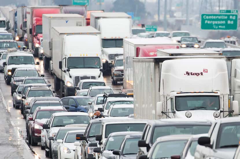 LBJ Freeway traffic backs up near Shiloh Road on an icy morning last winter in Garland in...