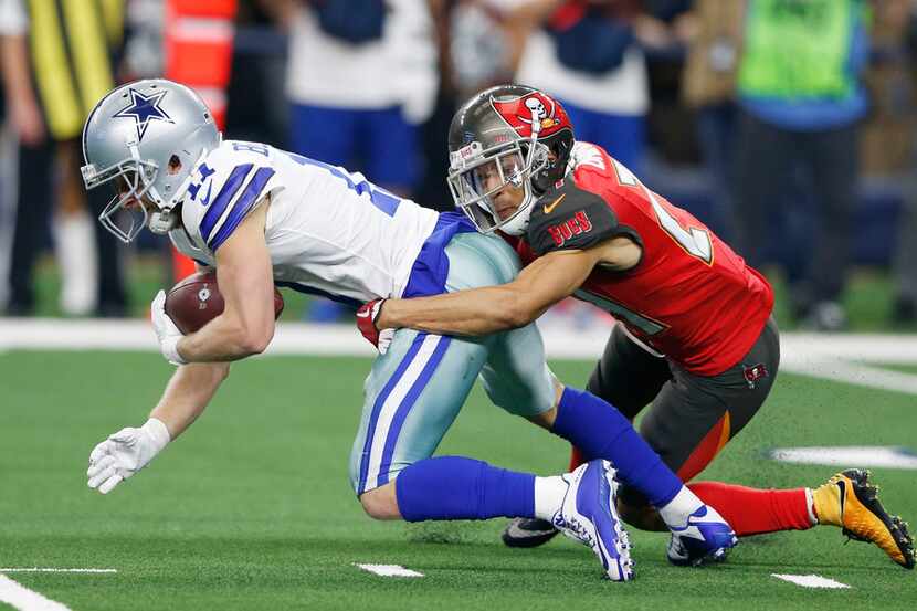 Dallas Cowboys wide receiver Cole Beasley (11) makes the first down as Tampa Bay Buccaneers...