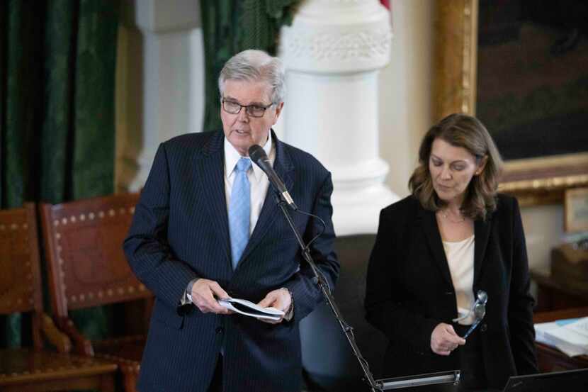 Lt. Gov. Dan Patrick reads from a rule book on Saturday, May 29, 2021. At right is Senate...