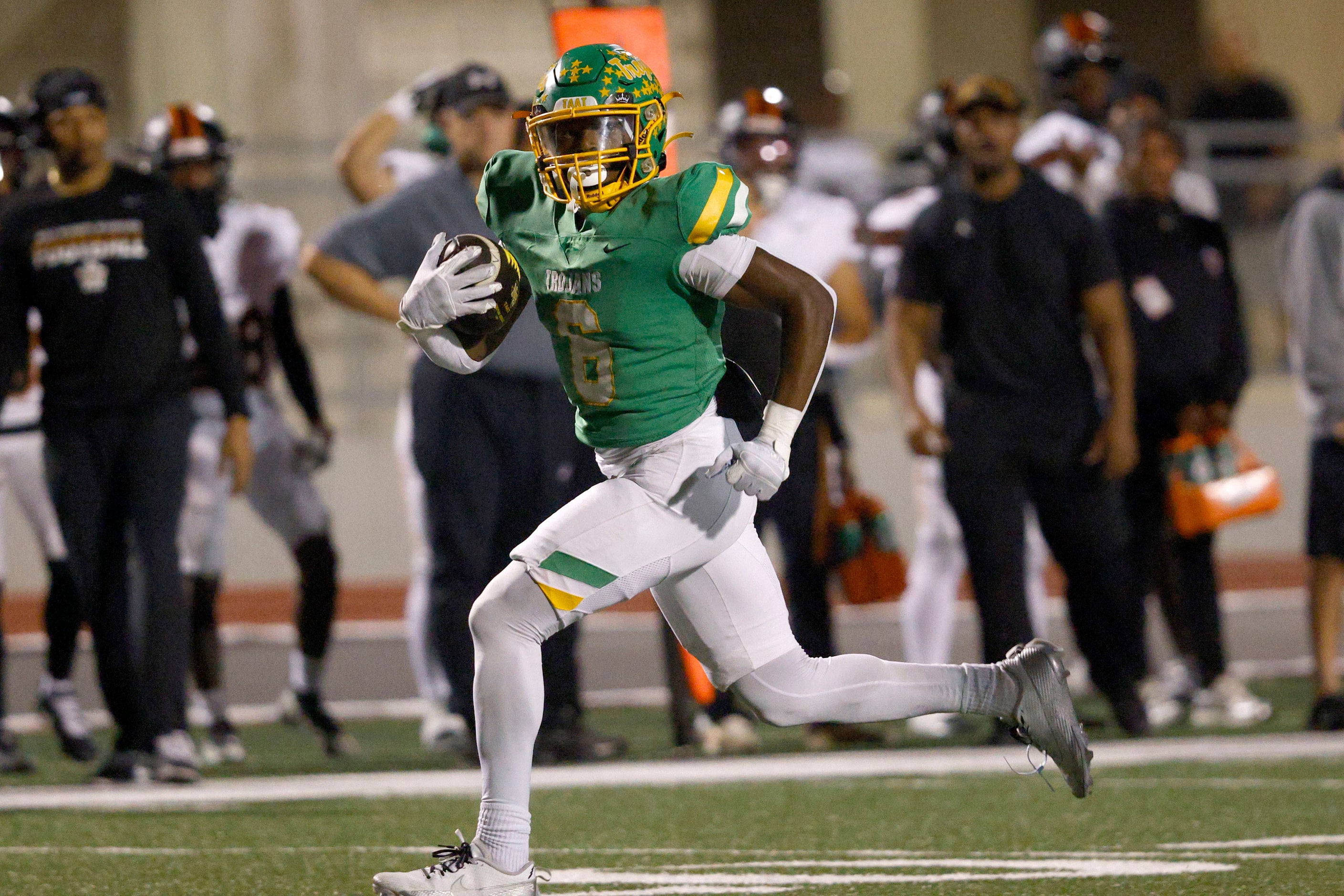 Newman Smith's Allijah Harrison (6) runs for a touchdown in the first half of a high school...