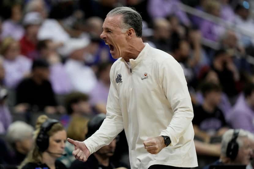 TCU head coach Jamie Dixon reacts during the first half of an NCAA college basketball game...