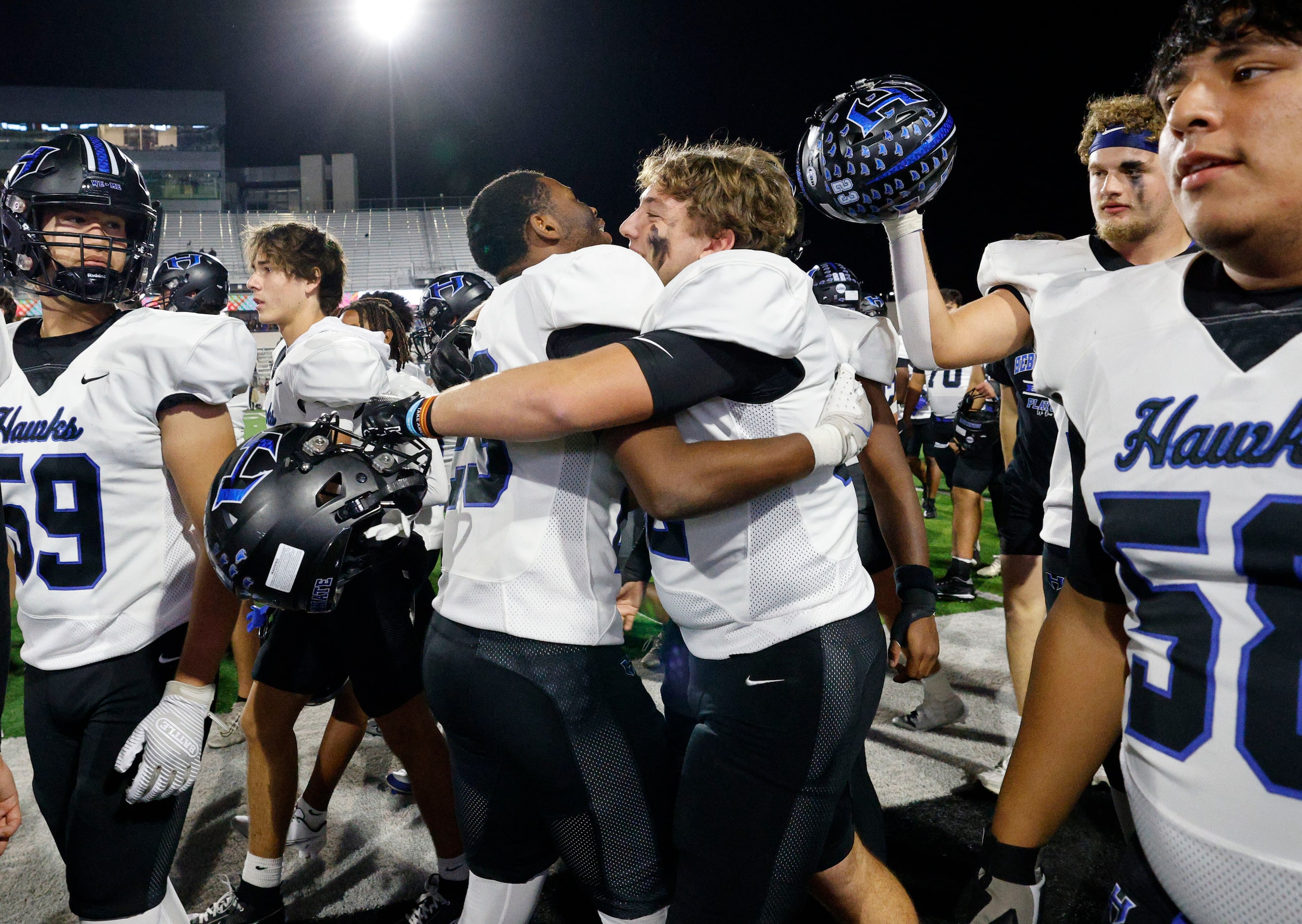 Hebron players celebrate their 48-16 victory against Rock Hill after a high school football...