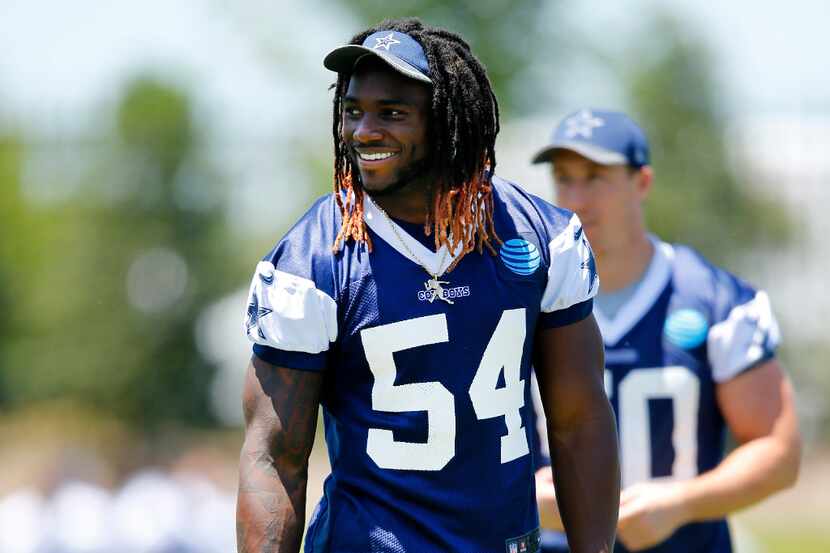 Dallas Cowboys linebacker Jaylon Smith (54) flashes a smile during the end of organized team...