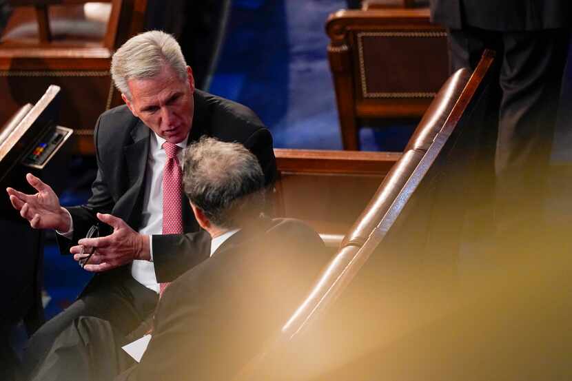 Rep. Kevin McCarthy, R-Calif., talks with Rep. Andrew Clyde, R-Ga., after McCarthy failed to...
