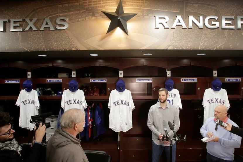 Free agent right-handed pitcher Chris Martin talks with area media after signing to a...