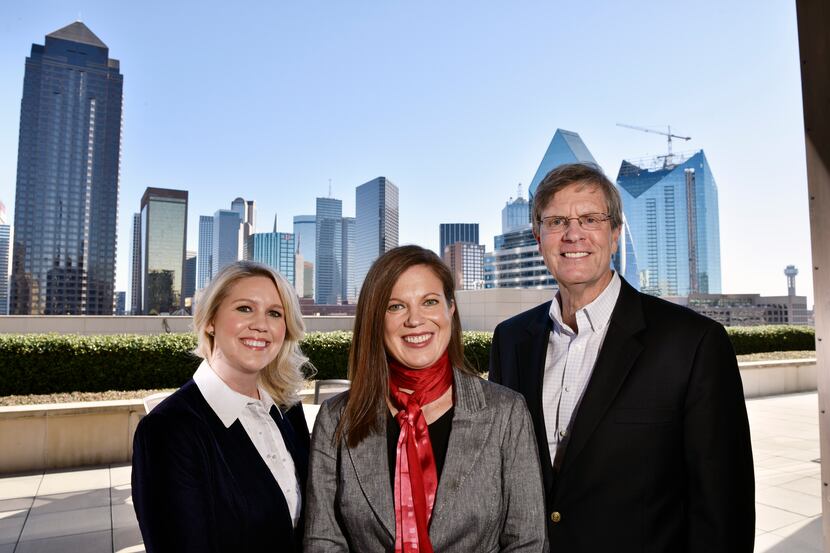 Kelly Rentzel, center, general counsel for Texas Capital Bank, with a member of her informal...