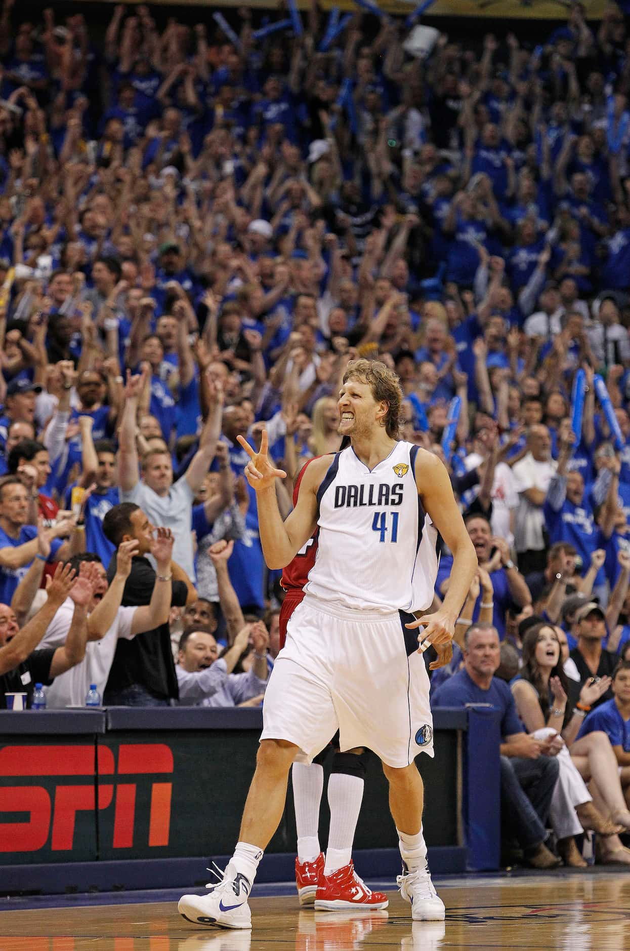 Dallas Mavericks power forward Dirk Nowitzki (41) reacts after hitting a solid 3-pointer....