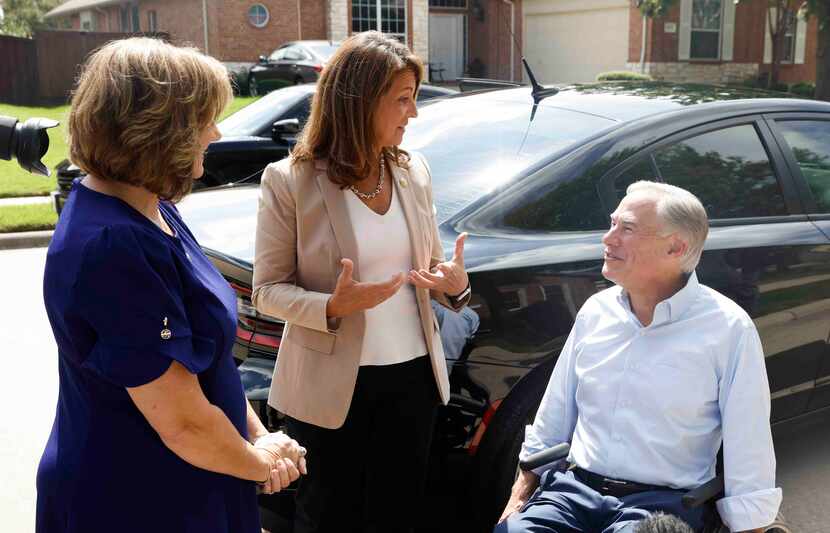 Texas Gov. Greg Abbott, shown campaigning last August with Republican state Reps. Candy...