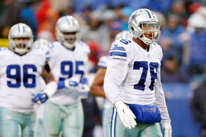 Dallas Cowboys defensive end Greg Hardy (76) looks up before the start of the next play...