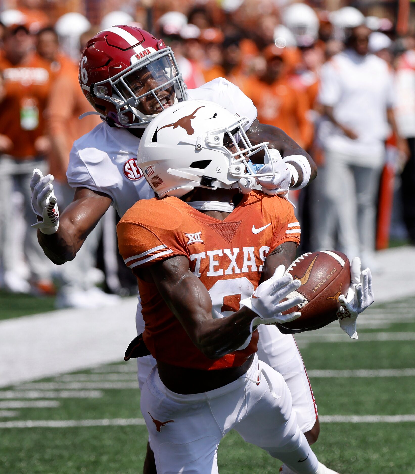 Texas Longhorns wide receiver Xavier Worthy (8) pulls in a long pass and nearly scores...