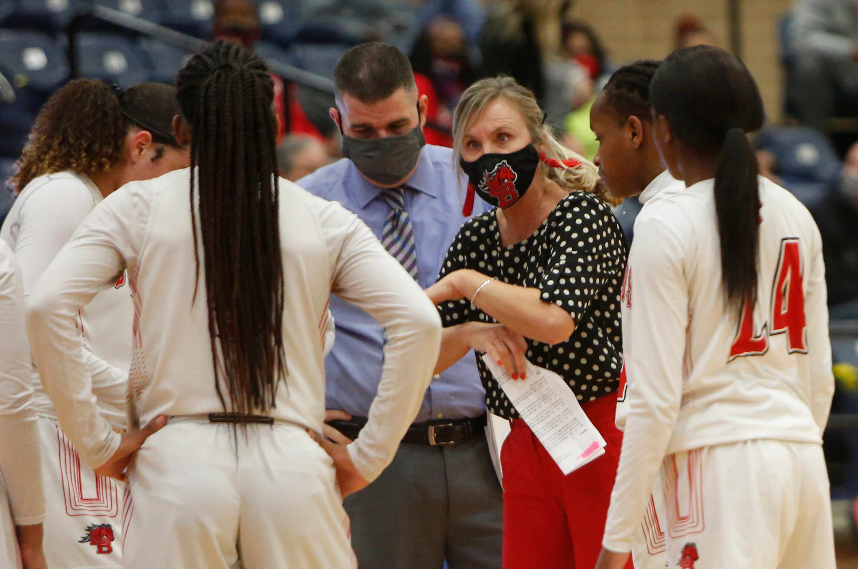 Mansfield Legacy head coach Michelle Morris speaks with her players during a timeout during...
