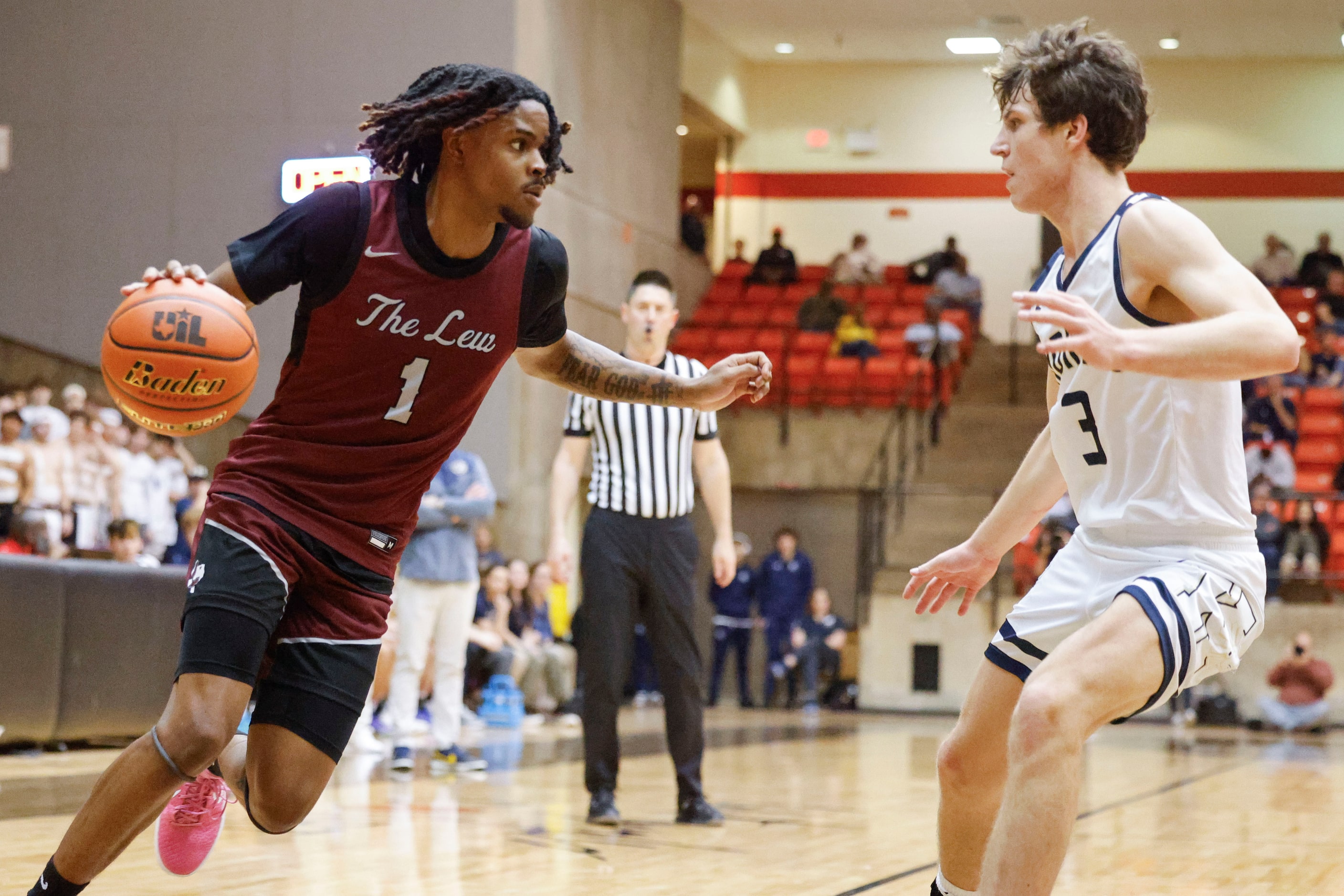 Lewisville High’s Landon Brown (left) attempts to dribble past Keller High’s Quinn Estep...