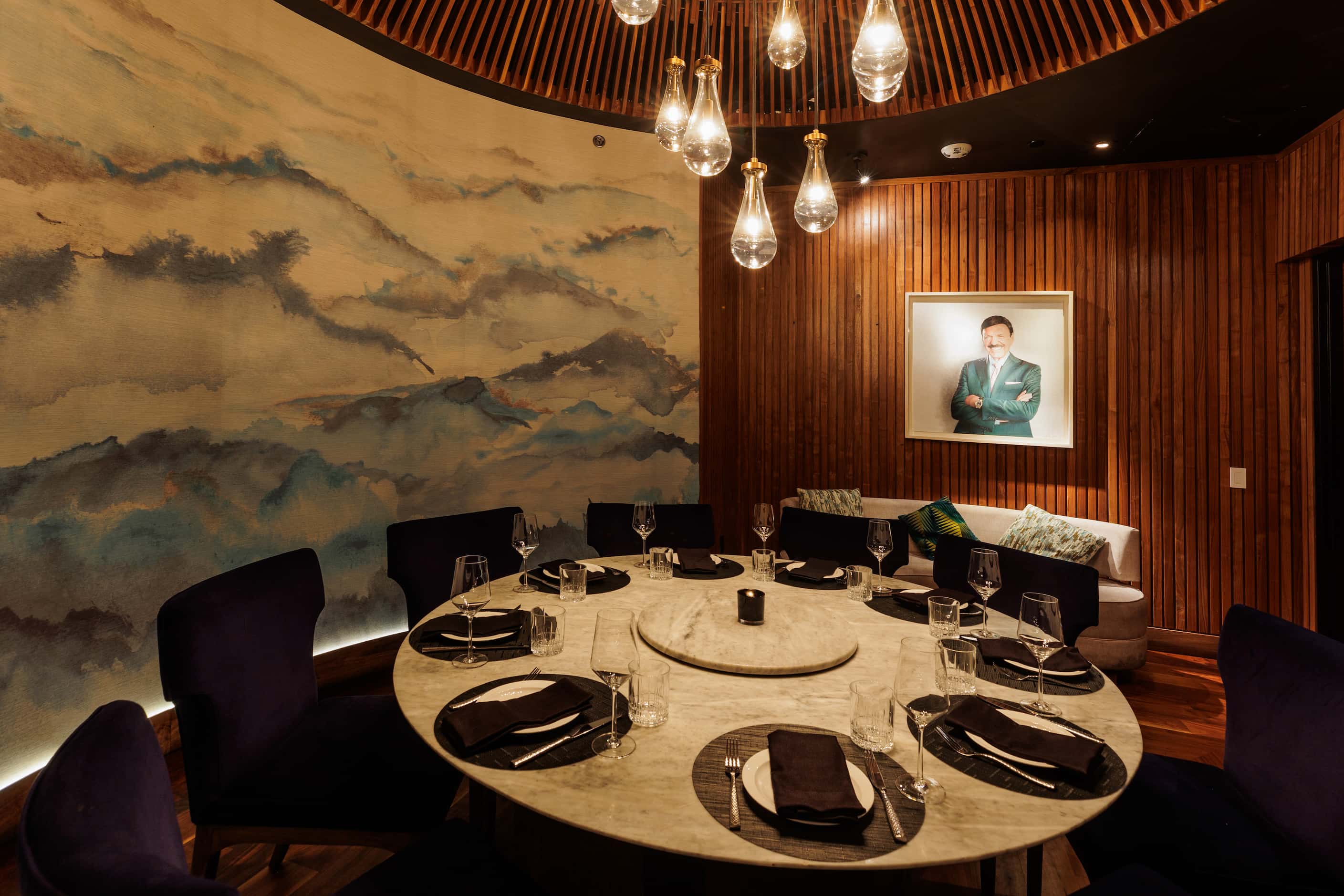 Near the bar at The Mexican is a circular private room with a wall of art.