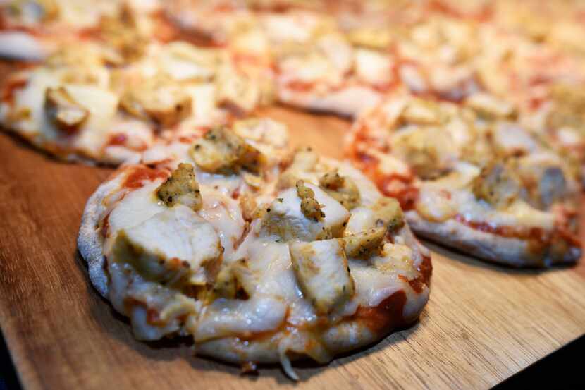 Samples of chicken pizzas, made with whole-grain crusts, were served during a Dallas ISD...