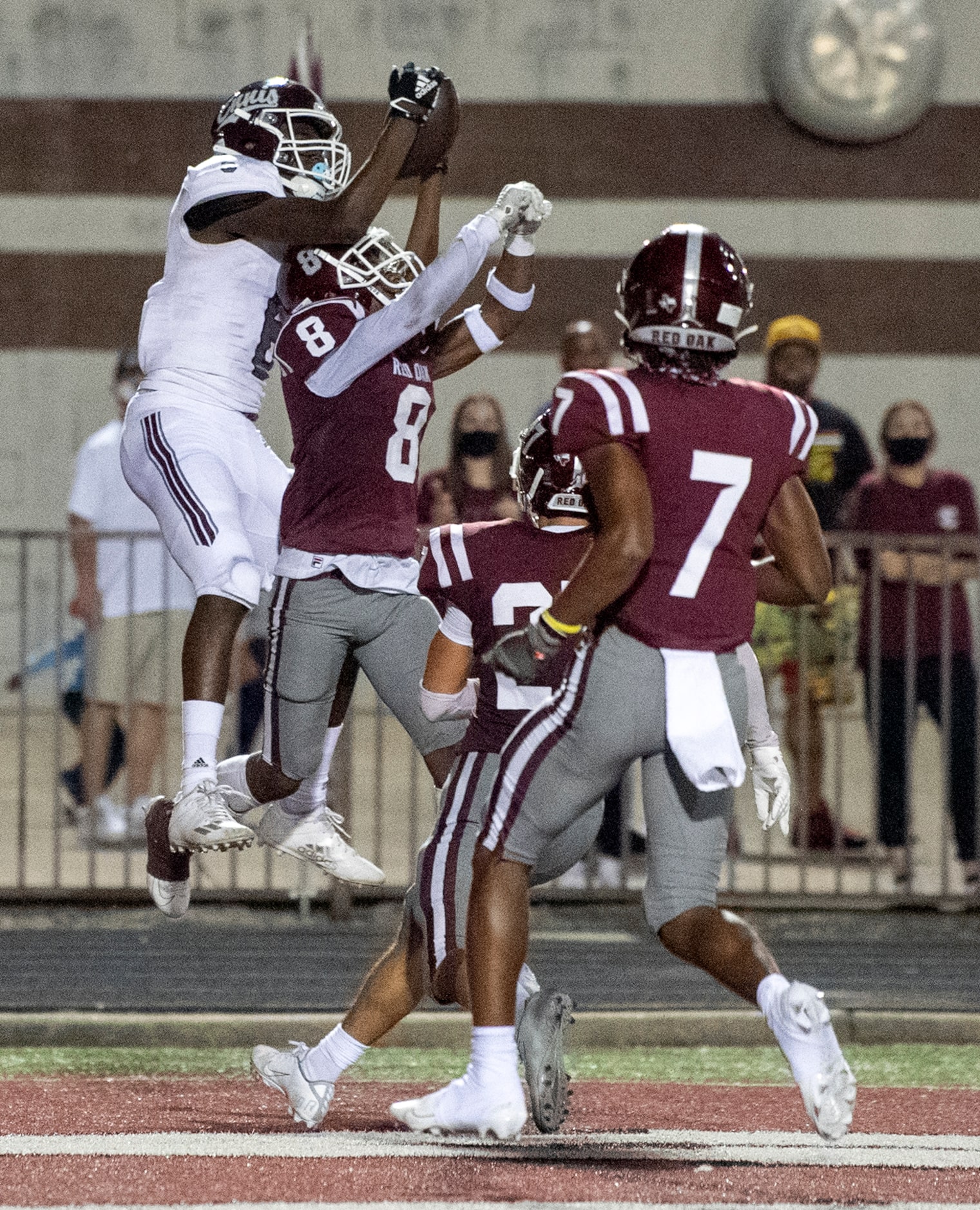 Ennis junior wide receiver Skylan Simmons (6) hauls in a touchdown pass over Red Oak senior...