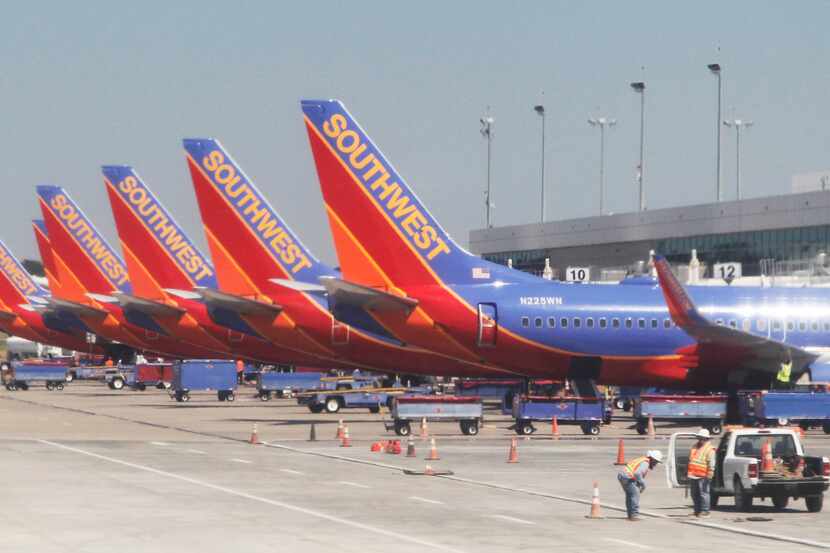  Southwest Airlines planes lined up at terminals at Dallas Love Field Airport in Dallas...