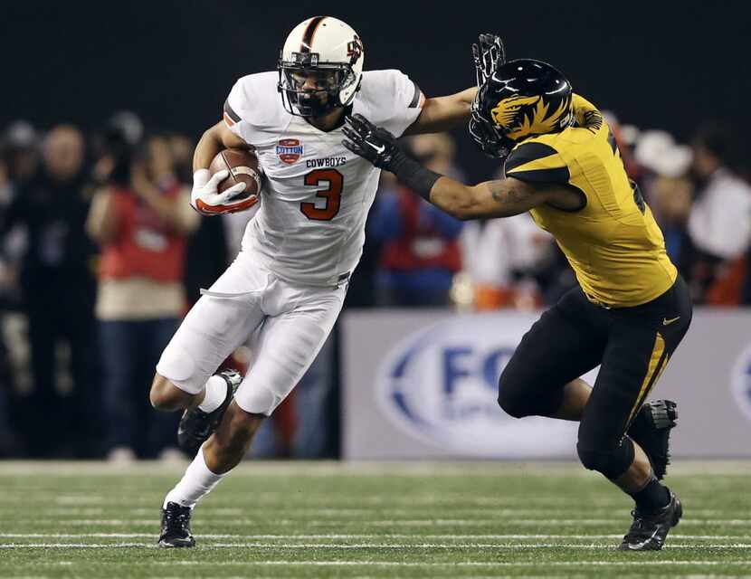Oklahoma State Cowboys wide receiver Marcell Ateman (3) attempts to evade Missouri Tigers...